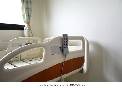 Close Up Of Hospital Bed With No Patient In Room.