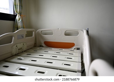 Close Up Of Hospital Bed With No Patient In Room.