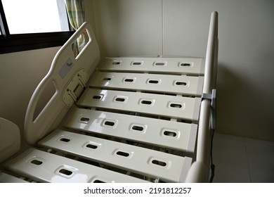 Close Up Of Hospital Bed With No Patient In Room.