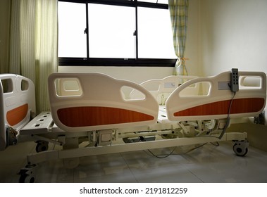 Close Up Of Hospital Bed With No Patient In Room.