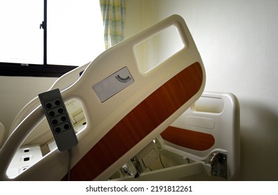 Close Up Of Hospital Bed With No Patient In Room.