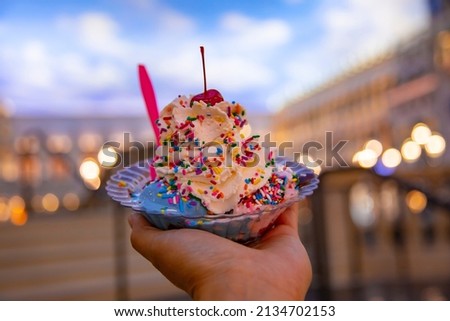 Close up to a huge and delicious ice cream decorated with colored sprinkles in a famous ice cream parlor in Las Vegas