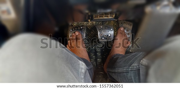 Close up - Human\
Feets Pressing Car Pedals