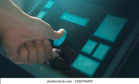 Close up human finger is touching interface computer monitor, fingerprint biometric identity and approval.  future security and password control through fingerprints 
