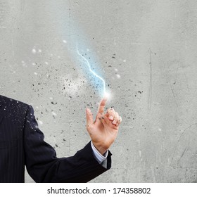 Close up of human hand with flash of lightning