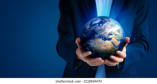 Close Up Human Hands Holding Planet Earth. Earth Day. Energy Saving Concept. World In Business Man Hand On Dark Background. Save Earth. Environment Concept. Care Of The Enviro.