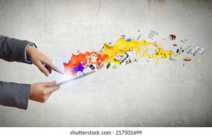 Close up of human hands holding tablet pc