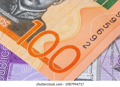 Close Up To Hundred Pesos Of The Dominican Republic. Paper Banknotes Of The Caribbean Country. Detailed Capture Of The Big One Hundred And The Serial Number. Detailed Money Background Wallpaper.