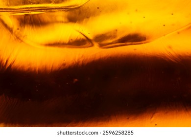 Close up Ice cube in whiskey texture background, macro close up of Ice cubes in glass of whiskey or another alcohol,Crystal design 
