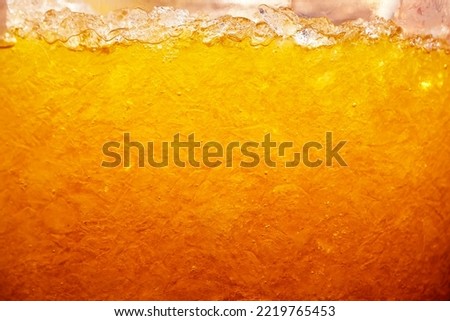 Close up of ice in a glass of ice tea for background.                           