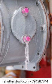 Close Up Icicles On Gas Utility Meter Gray And Pink Texture 