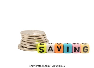 Close Up Image Of The Alphabet Dice Of A Word SAVING And Coins, Isolated On White Background And Clipping Path Is Embedded. This Is For The Concept Of Finance, Money Saving And Banking.