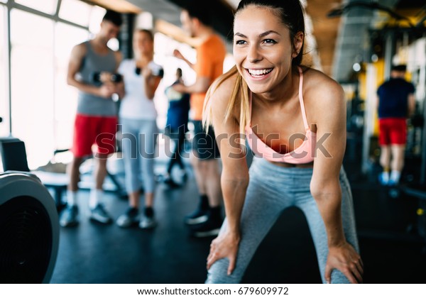 Close up image of\
attractive fit woman in\
gym