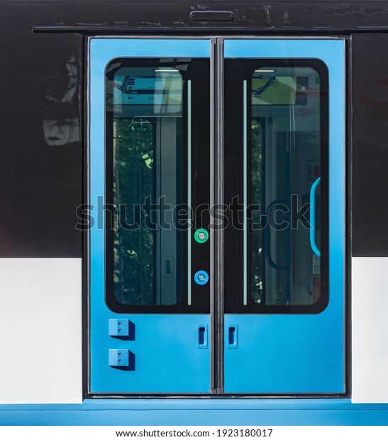 Close up\
image of the automatic doors of the\
train.