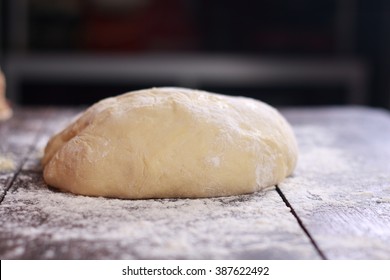 Close up image of bread dough on table in the kitchen