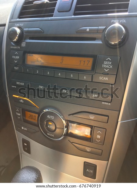 Close up image of car console and\
audio system. Car audio is equipment installed in a\
car.
