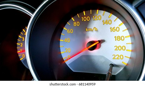 Close up image of car speedometer.