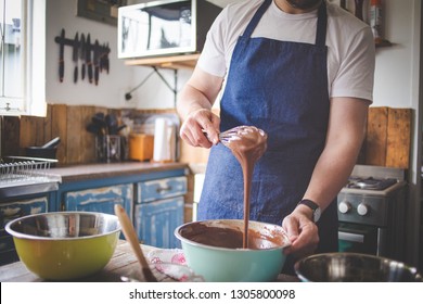 Close Up Image Of A Chef Stirring Cake Batter For Baking A Cake.