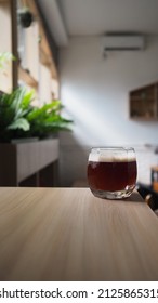 Close Up Image Of Coffee Mocktail On Wooden Table