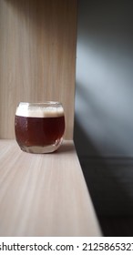 Close Up Image Of Coffee Mocktail On Wooden Table