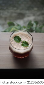 Close Up Image Of Coffee Mocktail On Wooden Table