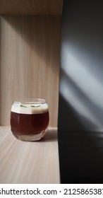 Close Up Image Of Coffee Mocktail On Wooden Table