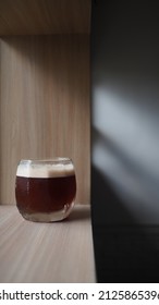 Close Up Image Of Coffee Mocktail On Wooden Table