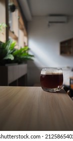 Close Up Image Of Coffee Mocktail On Wooden Table