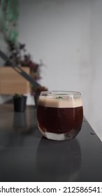 Close Up Image Of Coffee Mocktail On Wooden Table