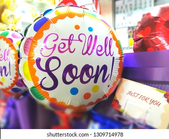 Close Up Image Of A Colorful Balloon With Text Get Well Soon. Selective Focus, Shallow Dof. Copy Space In Card Just For You.