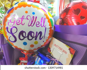 Close Up Image Of A Colorful Balloon With Text Get Well Soon. Selective Focus, Shallow Dof. Copy Space In Card Just For You.