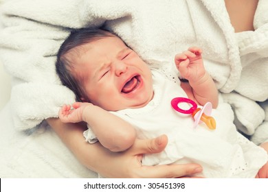Close up image of crying newborn baby