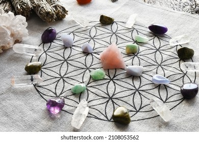 A close up image of a crystal healing grid using sacred geometry and a variety of healing crystals. 