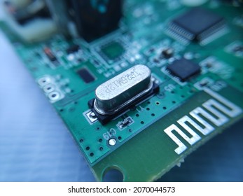 Close up image of crystal oscillator or electronic oscillator circuit. Electronic component.