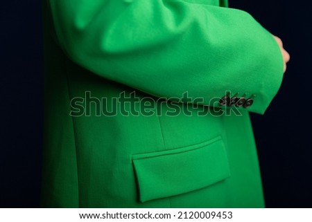 Close up image of fashionable green blazers on a woman. Woman's fashion classic jacket in details. Mockup for print or design template