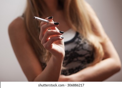 Close Up Image Of Female Hand Holding Cigarette
