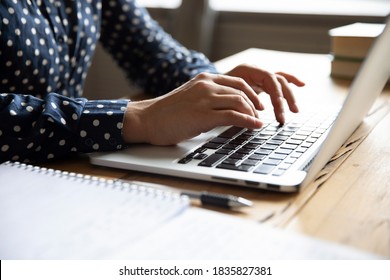 Close up image female hands typing on laptop keyboard. Businesswoman text response to client e-mail, customer buy on-line using web shop services. Internet and modern wireless technology usage concept