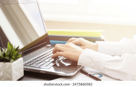 Close up image female hands typing on laptop keyboard. Businesswoman text response to client e-mail, customer buy on-line using web shop services. Internet and modern wireless technology usage concept - Powered by Shutterstock