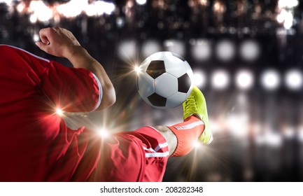 Close up image of footballer foot kicking the ball