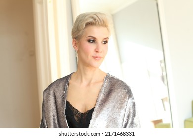 Close Up Image Of Good Looking Beautiful Blonde Female With Elegant Makeup And Pixie Hairstyle At Home