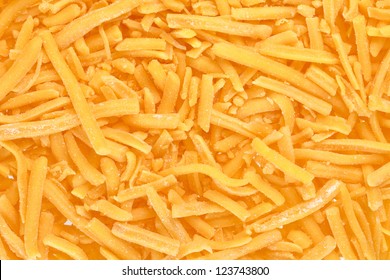 A Close Up Image Grated Cheddar Cheese