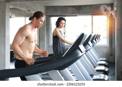 Close Up Image Of Healthy And Handsome Caucasian Muscle Man In Shirtless Who Running On Exercise Machine In Gym 