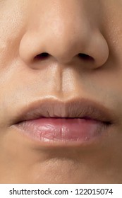 A Close Up Image Of A Human Face That Camera Focused On Nose And Lips