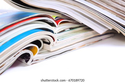 Close up image of magazines stack background. News and media publications. Magazines heap detail