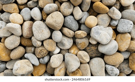 Close image of multicolor, shape and sizes stones. Loose pebble stone texture background.