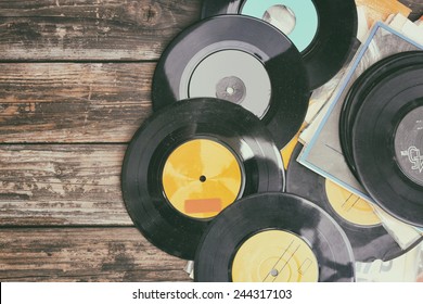 Close Up Image Of Old Records Over Wooden Table