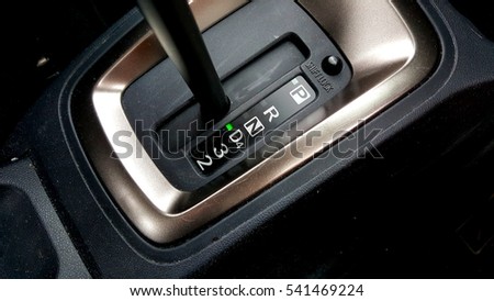 Close up image on hand auto gear on drive mode.