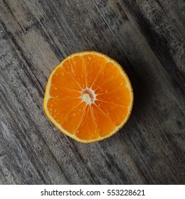 Close image of orange slice placed on kitchen counter-top