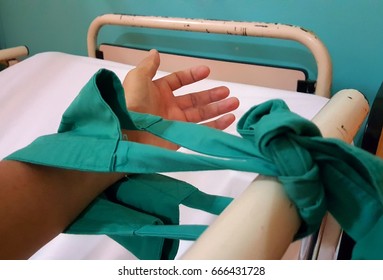 Close up image of patient hand restraint on hospital bed. - Shutterstock ID 666431728