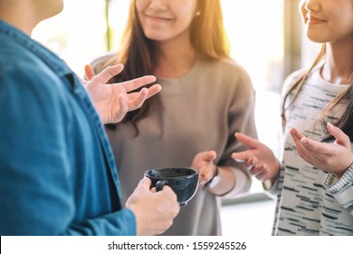 Close up image of people enjoyed talking and drinking coffee together